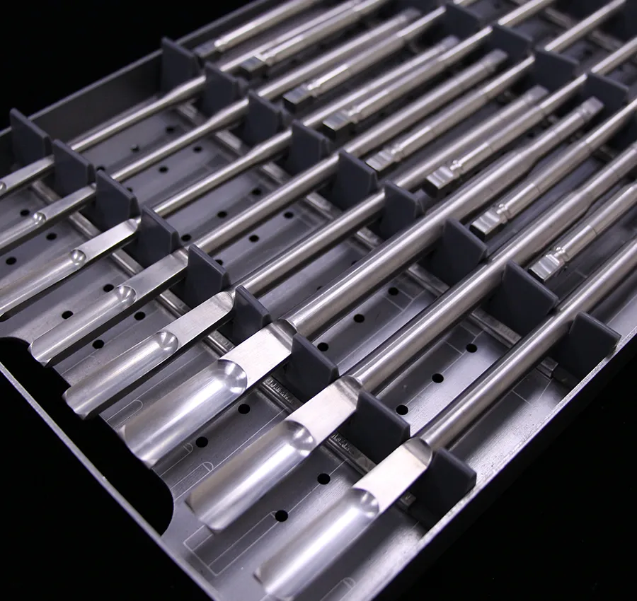 Precision surgical instruments neatly organized in stainless steel trays, showcasing high-quality CNC machining