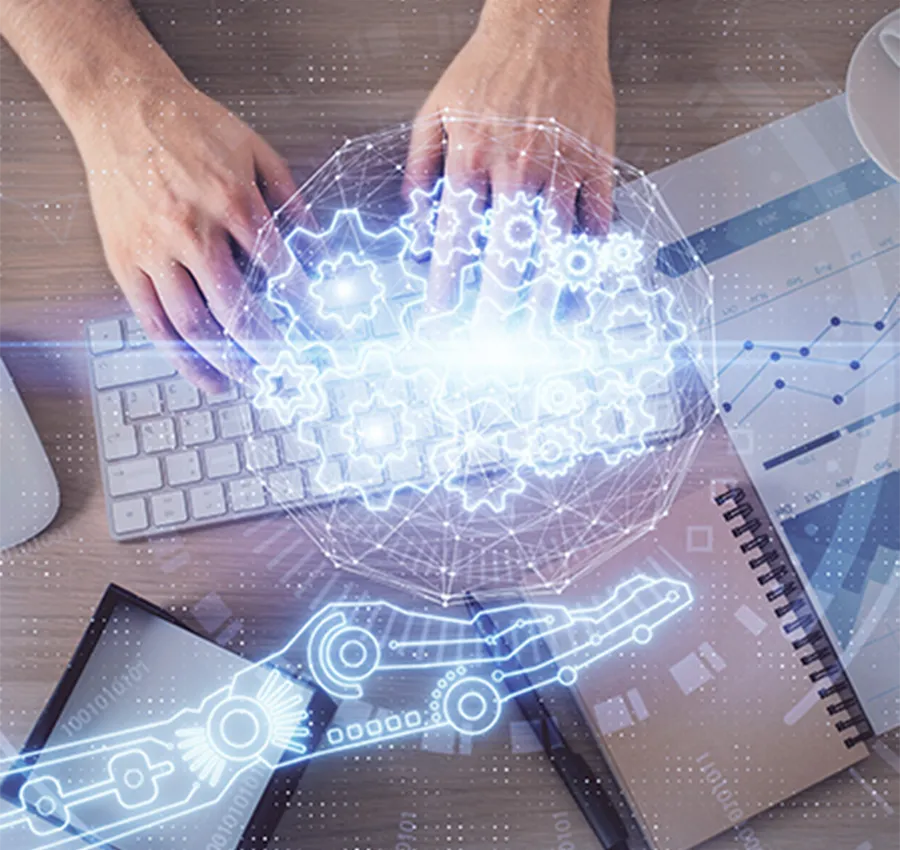 Engineer working on a keyboard with holographic graphics, representing digital prototyping for medical devices